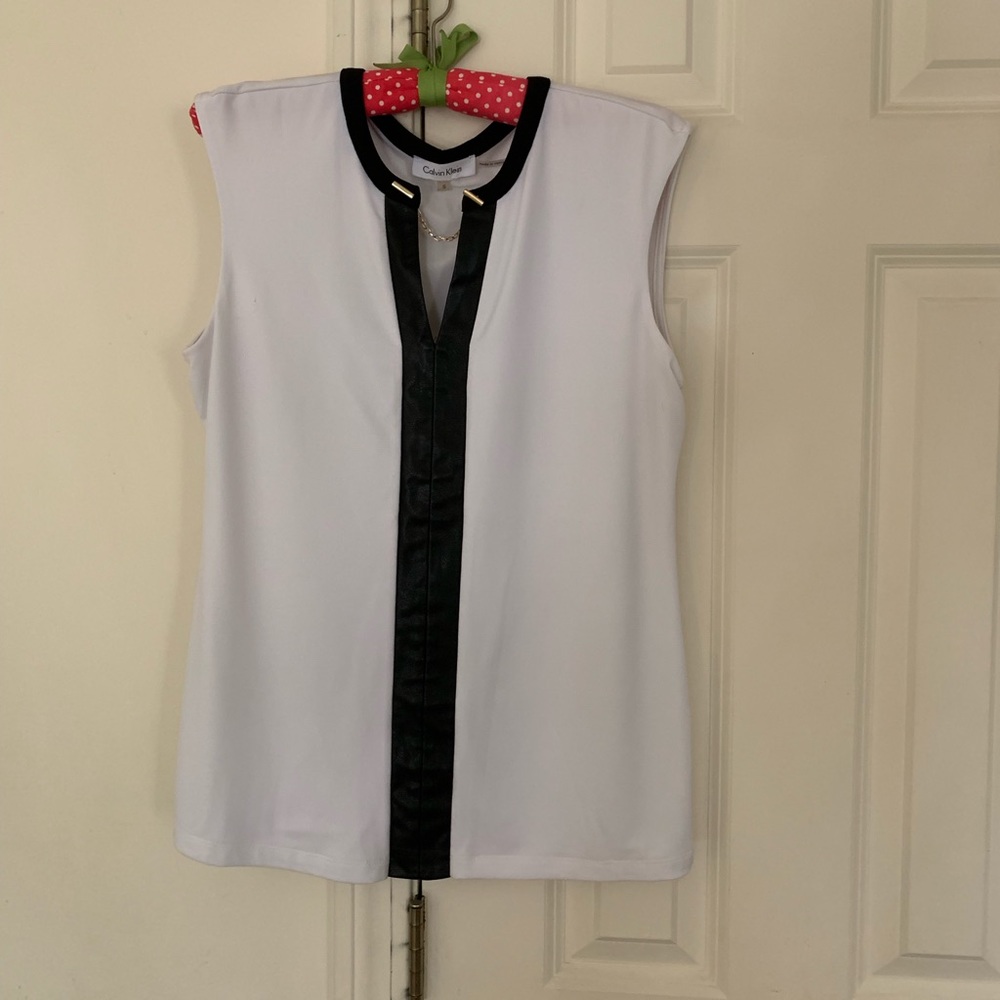 White top with faux leather trim